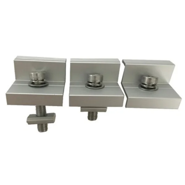 Precision end clamp securing a solar panel edge.